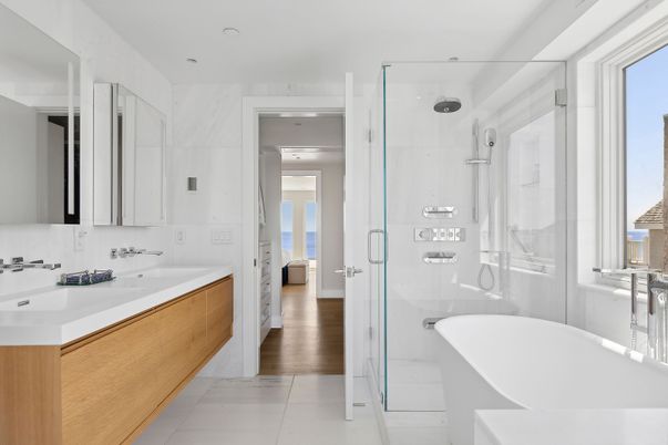Bathroom, Dual Sink Vanities, Free Standing Baths, Glass Shower, Interior, Marble, Marble Walls, Recessed Lighting, Wood Texture Flooring