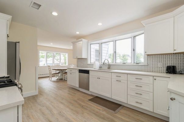 Dining room, Interior, Kitchen, Recessed Lighting, Stainless Steel Appliances, Wood Texture Flooring