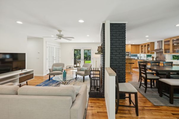Dining room, Fireplace, Interior, Kitchen, Living room, Recessed Lighting, Stone Walls, Wood Texture Flooring