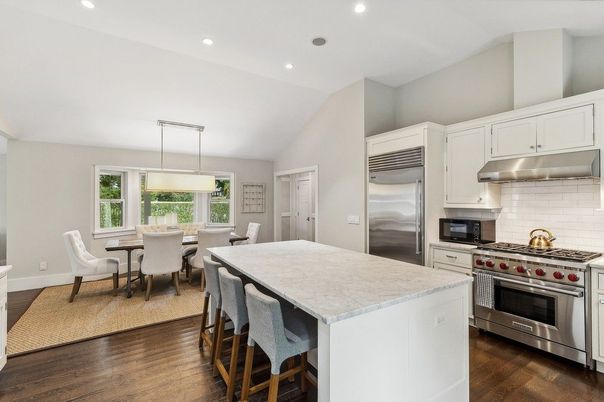 Dining room, Interior, Kitchen, Pendant Lights, Recessed Lighting, Stainless Steel Appliances, Wood Texture Flooring