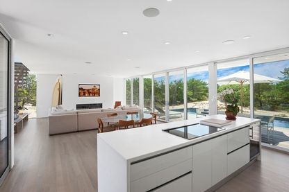 Dining room, Fireplace, Interior, Kitchen, Living room, Recessed Lighting, Water, Wood Texture Flooring