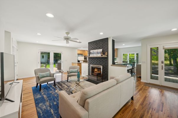 Fireplace, Interior, Living room, Recessed Lighting, Stone Walls, Wood Texture Flooring