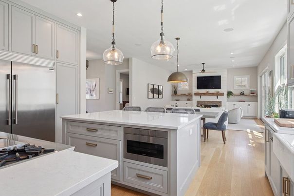 Dining room, Fireplace, Interior, Kitchen, Pendant Lights, Recessed Lighting, Stainless Steel Appliances, Wood Texture Flooring