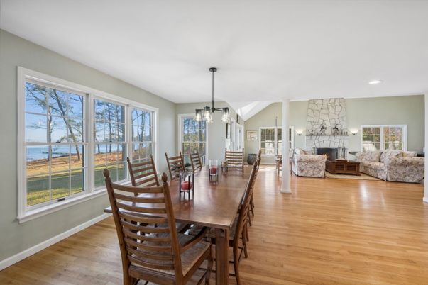 Dining room, Fireplace, Interior, Living room, Pendant Lights, Recessed Lighting, Water, Wood Texture Flooring