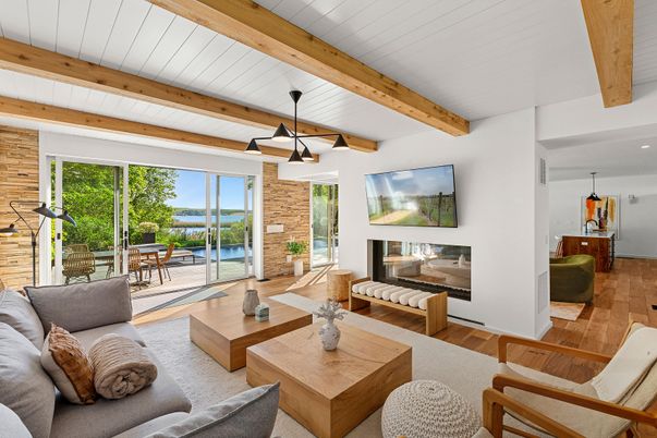 Fireplace, Interior, Living room, Pendant Lights, Recessed Lighting, Stone Walls, Water, Wooden Beams, Wood Texture Flooring