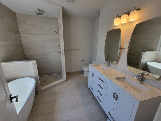 Bathroom, Dual Sink Vanities, Glass Shower, Interior, Wood Texture Flooring