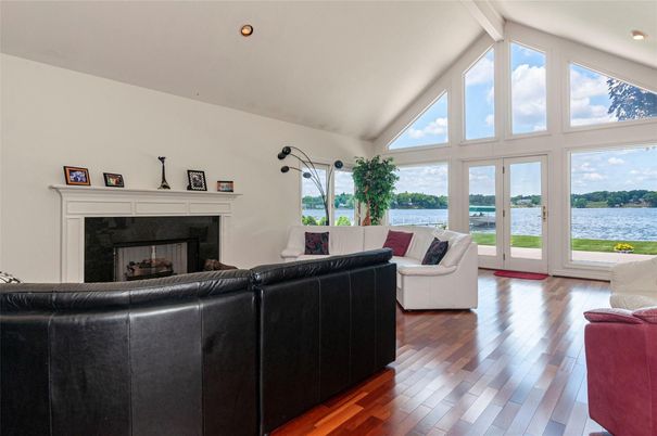 Fireplace, Interior, Living room, Recessed Lighting, Water, Wood Texture Flooring