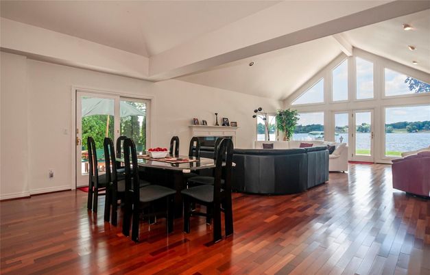 Dining room, Fireplace, Interior, Living room, Recessed Lighting, Water, Wood Texture Flooring