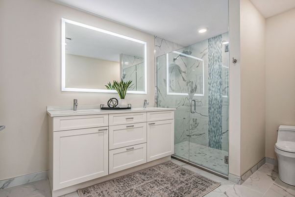 Bathroom, Dual Sink Vanities, Glass Shower, Interior, Marble, Marble Walls, Recessed Lighting