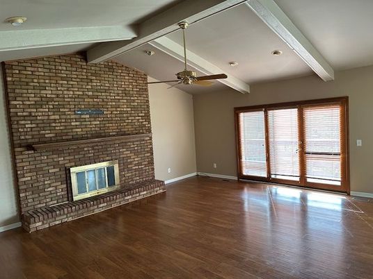 Empty room, Fireplace, Interior, Recessed Lighting, Stone Walls, Wood Texture Flooring