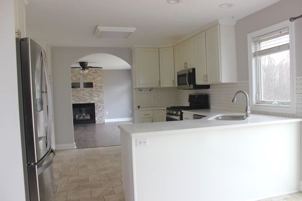 Fireplace, Interior, Kitchen, Recessed Lighting, Stainless Steel Appliances, Stone Walls