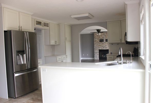 Fireplace, Interior, Kitchen, Recessed Lighting, Stainless Steel Appliances, Stone Walls