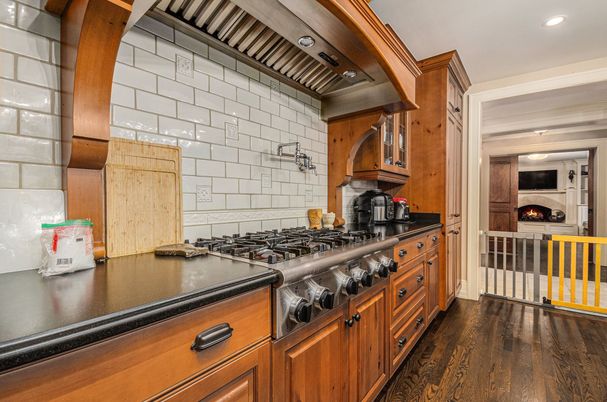 Fireplace, Interior, Kitchen, Recessed Lighting, Stainless Steel Appliances, Wood Texture Flooring