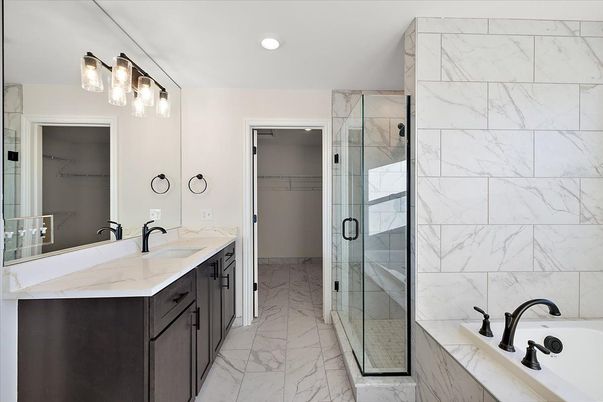Bathroom, Dual Sink Vanities, Glass Shower, Interior, Marble, Marble Walls, Recessed Lighting
