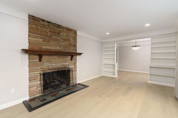 Empty room, Fireplace, Interior, Pendant Lights, Recessed Lighting, Stone Walls, Wood Texture Flooring