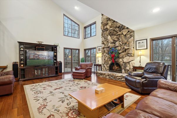 Fireplace, Interior, Living room, Recessed Lighting, Stone Walls, Wood Texture Flooring