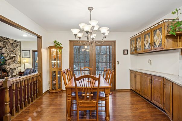 Chandelier, Dining room, Fireplace, Interior, Stone Walls, Wood Texture Flooring
