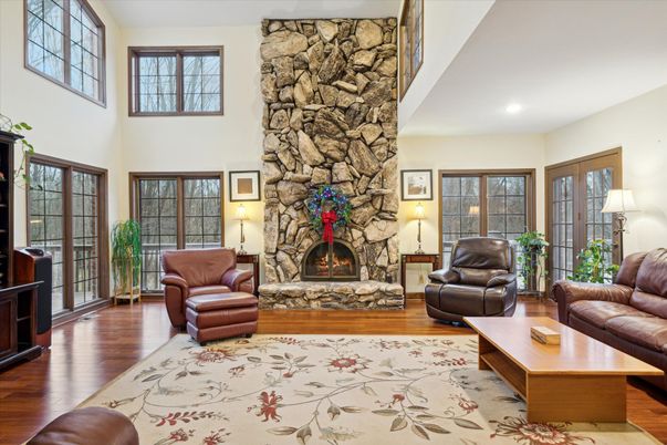 Fireplace, Interior, Living room, Recessed Lighting, Stone Walls, Wood Texture Flooring