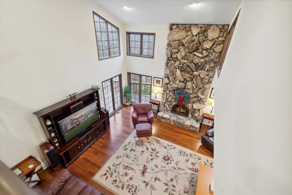 Fireplace, Interior, Living room, Recessed Lighting, Stone Walls, Wood Texture Flooring