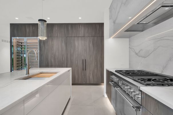 Interior, Kitchen, Marble Walls, Pendant Lights, Recessed Lighting, Stainless Steel Appliances