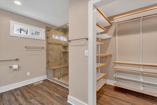 Bathroom, Glass Shower, Interior, Recessed Lighting, Walk-in Closets, Wood Texture Flooring