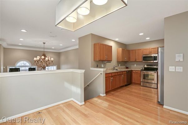 Chandelier, Interior, Kitchen, Recessed Lighting, Stainless Steel Appliances, Wood Texture Flooring
