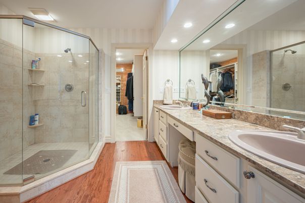 Bathroom, Dual Sink Vanities, Glass Shower, Interior, Recessed Lighting, Wood Texture Flooring