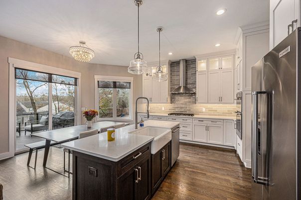 Chandelier, Dining room, Interior, Kitchen, Pendant Lights, Recessed Lighting, Stainless Steel Appliances, Wood Texture Flooring
