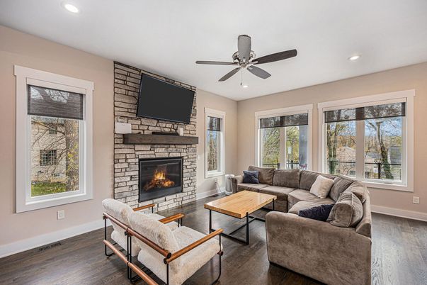 Fireplace, Interior, Living room, Recessed Lighting, Stone Walls, Wood Texture Flooring