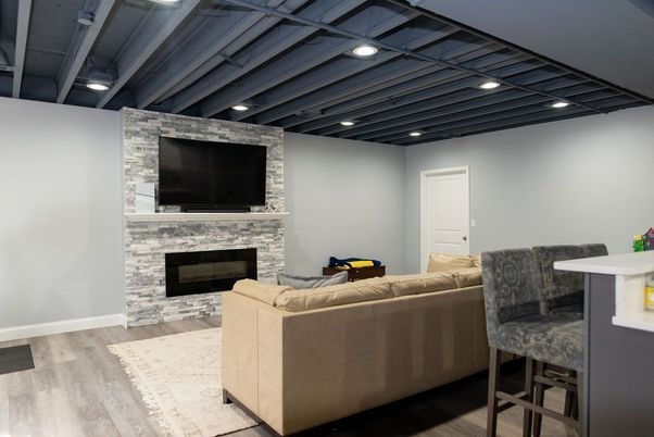Fireplace, Interior, Living room, Recessed Lighting, Stone Walls, Wood Texture Flooring