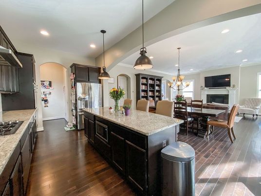 Chandelier, Dining room, Fireplace, Interior, Kitchen, Pendant Lights, Recessed Lighting, Stainless Steel Appliances, Wood Texture Flooring