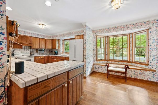 Interior, Kitchen, Recessed Lighting, Tile Countertops, Wood Texture Flooring