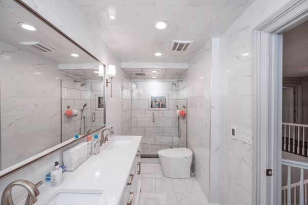 Bathroom, Dual Sink Vanities, Glass Shower, Interior, Marble, Marble Walls, Recessed Lighting