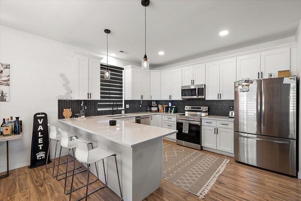 Interior, Kitchen, Pendant Lights, Recessed Lighting, Stainless Steel Appliances, Wood Texture Flooring