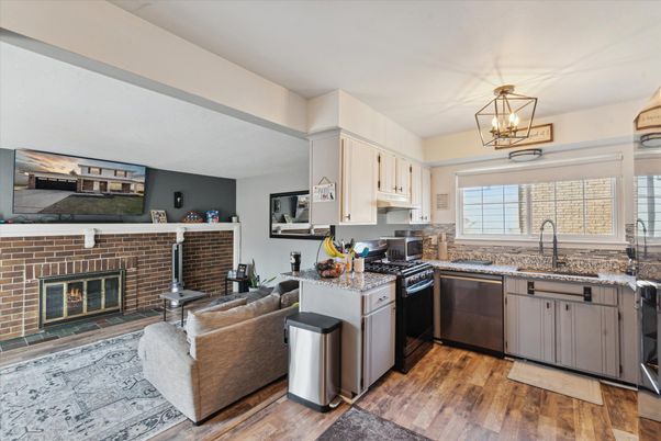 Fireplace, Interior, Kitchen, Living room, Pendant Lights, Stone Walls, Wood Texture Flooring