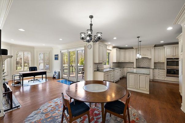 Chandelier, Dining room, Interior, Kitchen, Pendant Lights, Recessed Lighting, Stainless Steel Appliances, Wood Texture Flooring
