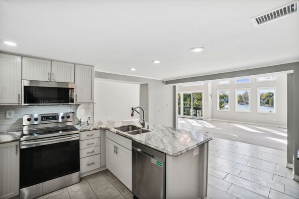 Interior, Kitchen, Recessed Lighting, Stainless Steel Appliances, Wood Texture Flooring
