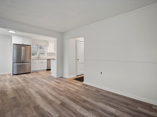 Empty room, Interior, Kitchen, Recessed Lighting, Stainless Steel Appliances, Wood Texture Flooring