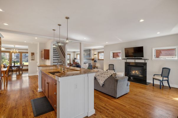 Dining room, Fireplace, Interior, Living room, Pendant Lights, Recessed Lighting, Wood Texture Flooring