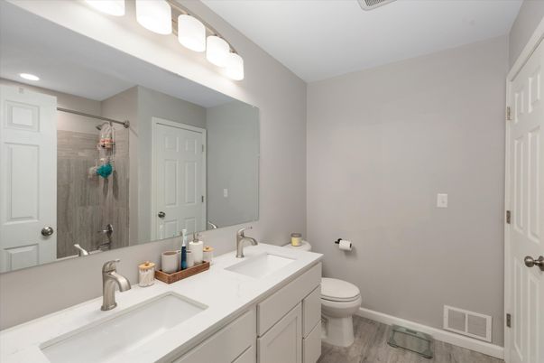 Bathroom, Dual Sink Vanities, Interior, Recessed Lighting, Wood Texture Flooring