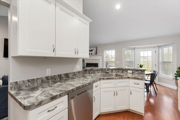 Dining room, Fireplace, Interior, Kitchen, Recessed Lighting, Wood Texture Flooring