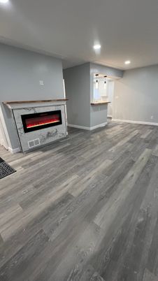 Empty room, Fireplace, Interior, Recessed Lighting, Wood Texture Flooring