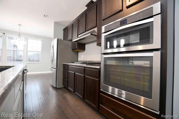 Chandelier, Interior, Kitchen, Recessed Lighting, Stainless Steel Appliances, Wood Texture Flooring
