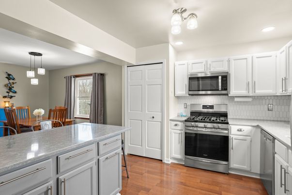 Dining room, Interior, Kitchen, Pendant Lights, Recessed Lighting, Stainless Steel Appliances, Wood Texture Flooring