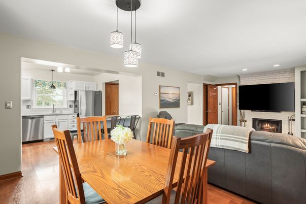 Dining room, Fireplace, Interior, Kitchen, Living room, Pendant Lights, Recessed Lighting, Stainless Steel Appliances, Wood Texture Flooring