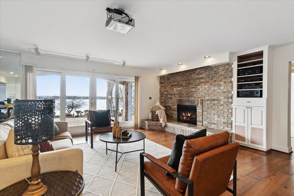 Fireplace, Interior, Living room, Recessed Lighting, Stone Walls, Wood Texture Flooring