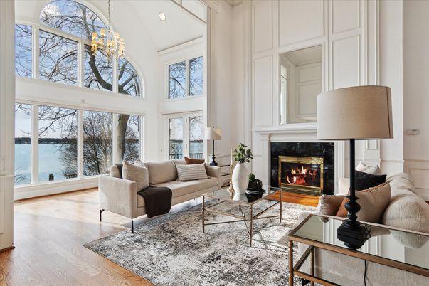 Chandelier, Fireplace, Interior, Living room, Recessed Lighting, Water, Wood Texture Flooring