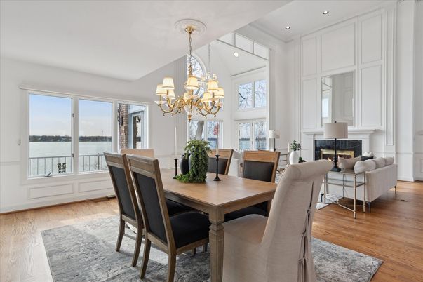 Chandelier, Dining room, Fireplace, Interior, Living room, Recessed Lighting, Water, Wood Texture Flooring