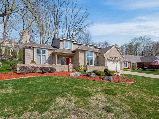 Attached, Backyard, Exterior, Facade, Brick Facade, Split Level