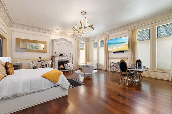 Bedroom, Chandelier, Fireplace, Interior, Wood Texture Flooring